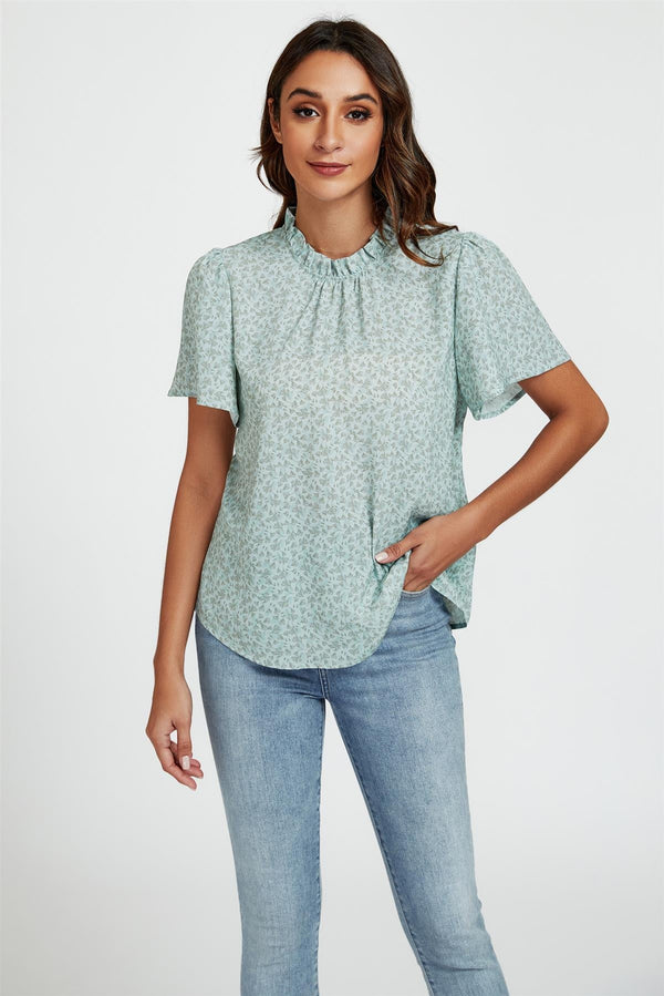 Grijze top/blouse met kleine bloemenprint, hoge hals en hoekmouwen in blauw